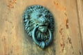 Detail photography of old metal door knocker lion head