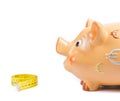 Detail of piggy bank and measure tape, concept for business and save money Royalty Free Stock Photo