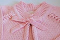 Detail of pink baby blouse made of tricot