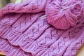 Detail of pink woven handicraft knit sweater