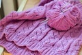 Detail of pink woven handicraft knit sweater