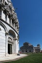 Detail of the Pisa baptistery and the cathedral in the background