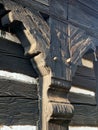 detail of a plinth, folk architecture, supporting element timbered, suppo Royalty Free Stock Photo