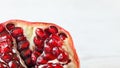 Detail of pomegranate Punica granatum insidem with light, almost white background space for text