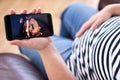 Detail Of Pregnant Woman Looking At 3D Image Of Baby On Mobile Phone Royalty Free Stock Photo