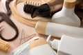 Detail of professional hair care products on wooden table elevated Royalty Free Stock Photo