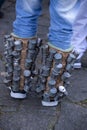 Detail of rattles on the legs of a group of revelers, rehearsing for the Congada Royalty Free Stock Photo