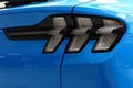 Detail of rear LED lights of modern electric american compact crossover car Ford Mustang Mach-E AWD, light blue color Royalty Free Stock Photo