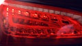 Detail of rear light on a modern car. Close-up of taillight, new right led rear brake light by night Royalty Free Stock Photo