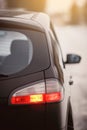 Detail of rear light on a modern car. Close-up of taillight, new right led rear brake light by night Royalty Free Stock Photo