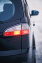 Detail of rear light on a modern car. Close-up of taillight, new right led rear brake light by night Royalty Free Stock Photo