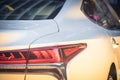 Close-up of rear light of modern white car Royalty Free Stock Photo
