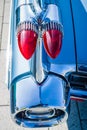 Detail of the rear wing and brake lights of the car Cadillac Coupe de Ville, 1959.