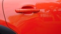 Detail of a red car. Closed car door. Royalty Free Stock Photo