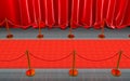 Detail of a red carpet with curtains and gold barriers Royalty Free Stock Photo