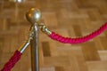 Detail of red rope on a exhibition space - defocused background concept image