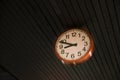 Detail of a red round wall clock on roof Royalty Free Stock Photo