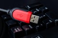 red USB cable on desktop computer keyboard background Royalty Free Stock Photo