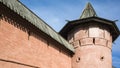 Detail of red wall and tower with wooden roof of Saint Euthymius monastery in Suzdal, Russian ancient architecture