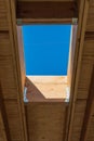 Detail of residential roof construction with framing for skylight, interior roof joists Royalty Free Stock Photo