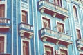 Detail of a restored colonial building in Old Havana with typical caribbean doors and balconies Royalty Free Stock Photo
