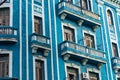 Detail of a restored colonial building in Old Havana with typical caribbean doors and balconies Royalty Free Stock Photo