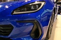 Detail of right front light of modern 2+2 japanese fastback coupe sports car Subaru BRZ
