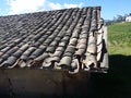 Detail of a roof made with tiles from an old village. an old building with a roof made of ceramic tiles. Banos Royalty Free Stock Photo