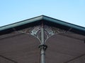 Detail of the roof of a music chapel with two iron lira`s Royalty Free Stock Photo