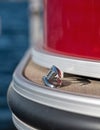 Detail of front rope cleat on red pontoon Royalty Free Stock Photo