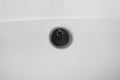 Detail of rubber bath plug. Drainage rubber stopper on white sink