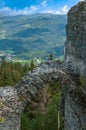 Detail of a ruined castle, with a panoramic view of the mountainous landscape Royalty Free Stock Photo