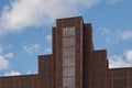 Detail`s facade of old industrial or factory building with rough red brick wall. Royalty Free Stock Photo