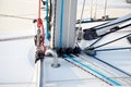 Detail of sailboat mast bottom with ropes Royalty Free Stock Photo