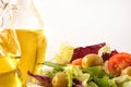 Detail of salad dressed with olive oil white isolated background