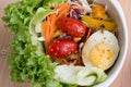 detail of salad with lettuce, tomato, egg and sesame sauce, clean food and fresh vegetable.