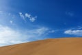 Detail of a sand dune against a blue sky at the Echoing Sand Mountain near the city of Dunhuang, in the Gansu Province