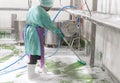 Detail of a scrubbing brush during spring cleaning of a PU floor with foam Royalty Free Stock Photo