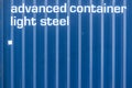 Detail of a sea freight container with the inscription advanced container light steel