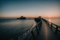 Detail of a seaside boardwalk at sunset