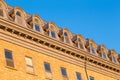 Detail of series of beautiful arched roof dormer windows in old townÃ¢â¬â¢s patrimonial building Royalty Free Stock Photo