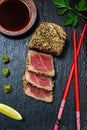 Detail of sesame seared ahi tuna on black slate Royalty Free Stock Photo