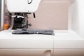 Detail of sewing machine and sewing accessories. Royalty Free Stock Photo
