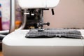 Detail of sewing machine and sewing accessories. Royalty Free Stock Photo