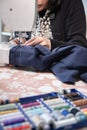 Detail of sewing work execution. Recycling clothes at home to reduce waste and avoid fast fashion. Woman sewing clothes at home. Royalty Free Stock Photo