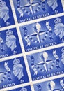 Detail from a sheet of 4d vintage postage stamps from the UK.