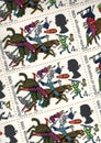 Detail from a sheet of vintage 4d postage stamps from the UK.