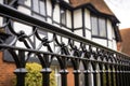 detail shot of black ironwork on a white tudor house