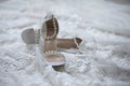 Detail shot of brides shoes and wedding dress before a wedding