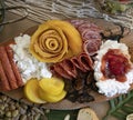 Detail shot of charcuterie table set up for lunch, with meats and cheeses in beautiful arrangement